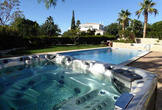 Hot tub overlooking backyard pool